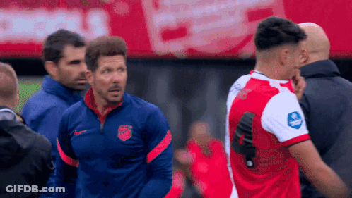 Soccer Player In Red And White Jersey With Blue Nike Logo GIF