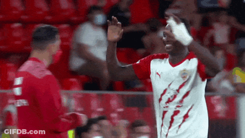 Soccer Player In Red And White Jersey With Lightning Bolt GIF