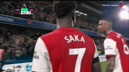 Soccer Player In Red And White Jersey With Saka GIF