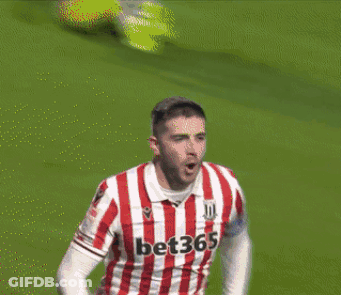 Soccer Player In Red And White Striped Jersey Number 23 GIF