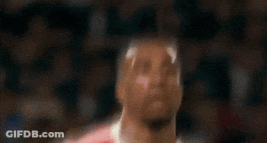 Soccer Player In Red And White Uniform Looking Up GIF