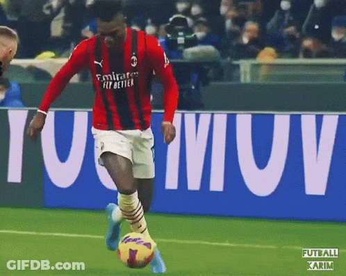 Soccer Player In Red Emirates Fly Better Jersey Kicking Ball GIF