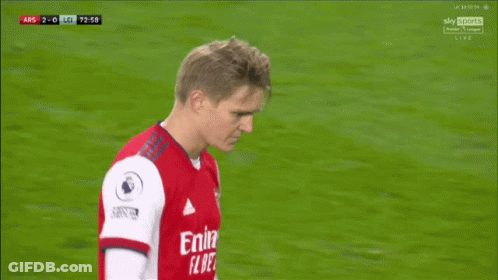 Soccer Player In Red Emirates Fly Better Shirt Talking To Another Player GIF