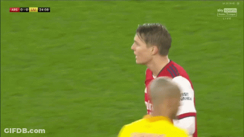 Soccer Player In Red Emirates Fly Better Shirt Talking To Player GIF