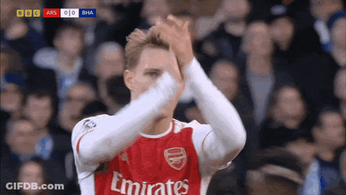 Soccer Player In Red Emirates Jersey Clapping GIF