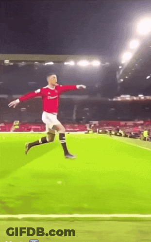 Soccer Player In Red Jersey Jumping GIF