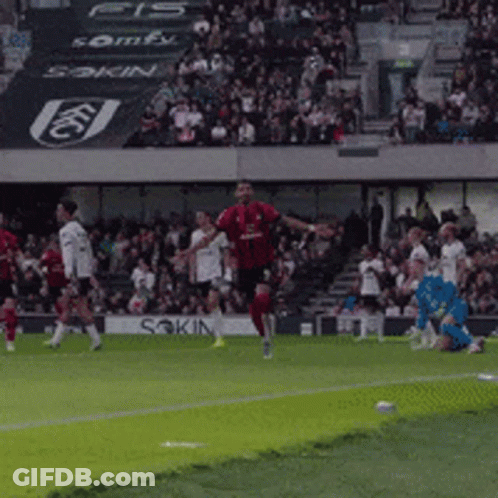 Soccer Player In Red Jersey Kicking Ball GIF