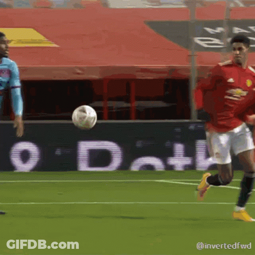 Soccer Player In Red Jersey Kicking Ball GIF