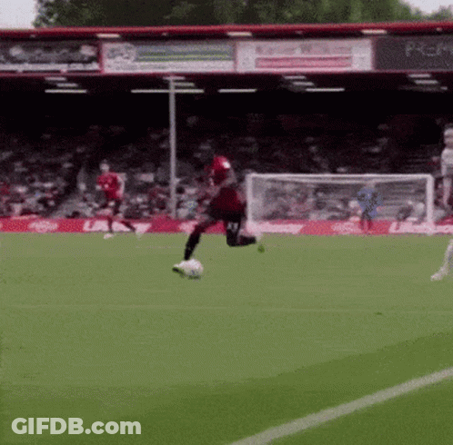 Soccer Player In Red Jersey Kicking Ball GIF