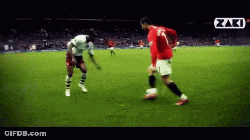 Soccer Player In Red Jersey Kicking Soccer Ball GIF