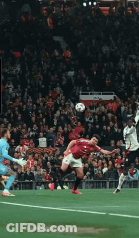 Soccer Player In Red Jersey Kicks Ball GIF
