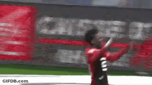 Soccer Player In Red Jersey Number 2 Running GIF