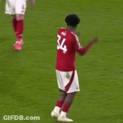 Soccer Player In Red Jersey Number 34 Dancing On Field GIF
