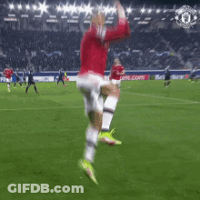 Soccer Player In Red Jersey Number 7 Jumping GIF