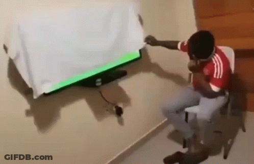 Soccer Player In Red Jersey Pointing Up GIF