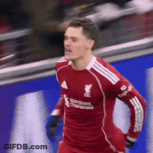 Soccer Player In Red Jersey Saying Standard Chartered GIF