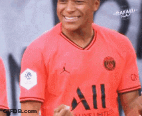 Soccer Player In Red Jersey Smiling GIF