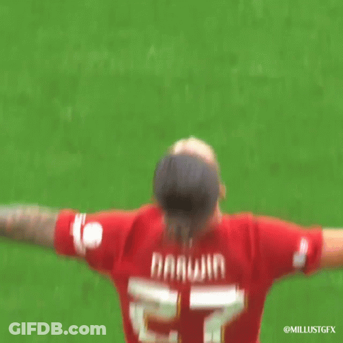 Soccer Player In Red Jersey With Darwin On Back GIF