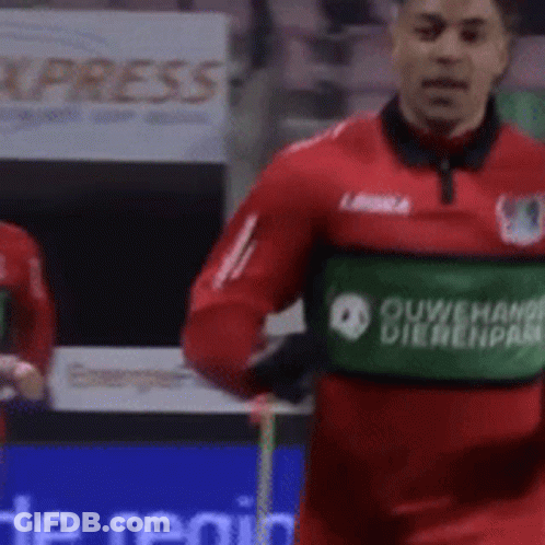 Soccer Player In Red Jersey With Green Ouwehand Dierenpark Patch GIF