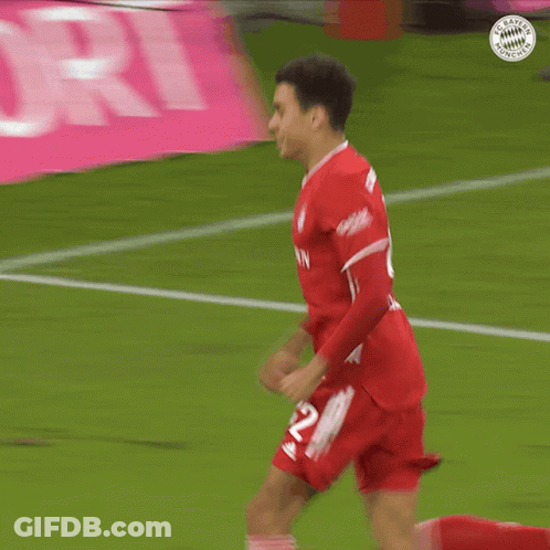 Soccer Player In Red Jersey With Number 12 GIF