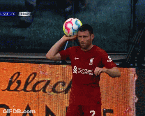 Soccer Player In Red Jersey With Standard Chartered GIF