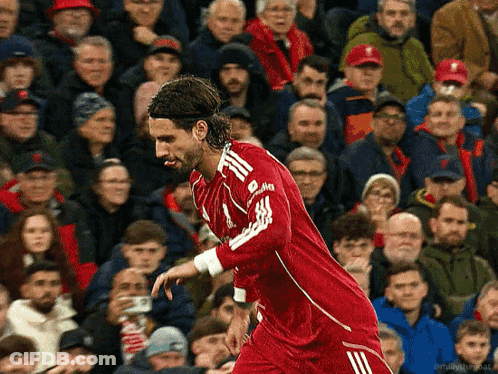 Soccer Player In Red Jersey With White Adidas Logo GIF