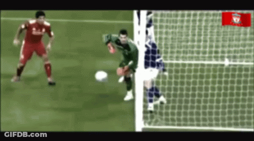Soccer Player In Red Liverpool Jersey Kicking Ball GIF