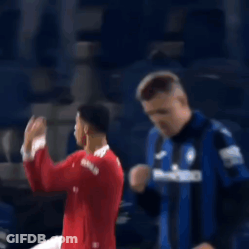 Soccer Player In Red Shirt Dancing, Another Watching GIF