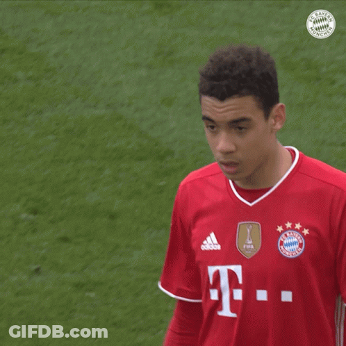 Soccer Player In Red Shirt With Letter T GIF