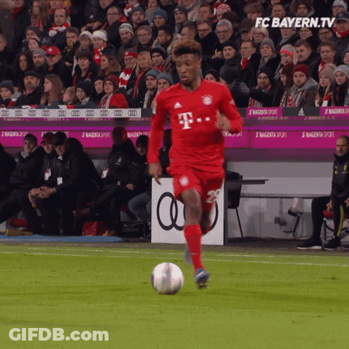 Soccer Player In Red T-Mobile Jersey Kicks Ball GIF