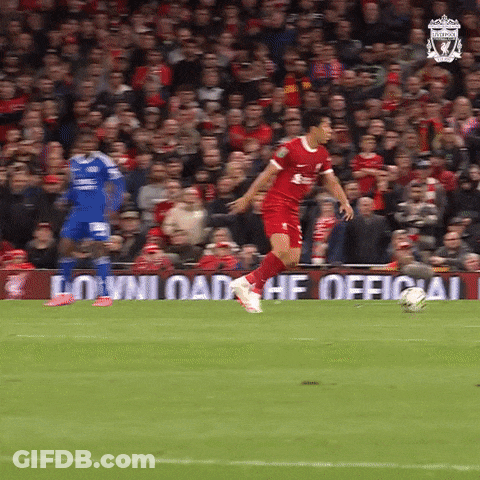 Soccer Player In Red Uniform Kicking Ball GIF