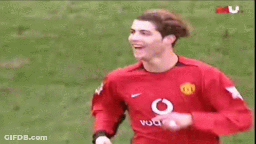 Soccer Player In Red Vodafone Jersey Smiling GIF
