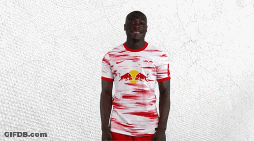 Soccer Player In Red-White Jersey With Bull GIF