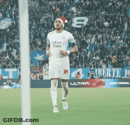Soccer Player In Santa Hat Running GIF