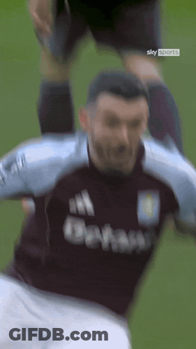Soccer Player In Sky Sports Shirt Being Tackled GIF