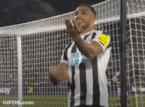 Soccer Player In Striped Jersey With Captain Armband GIF