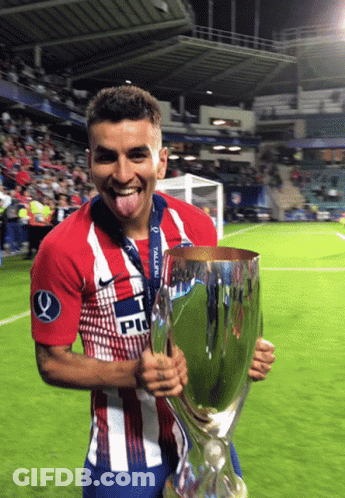 Soccer Player In 'T PU' Shirt Holding Trophy GIF