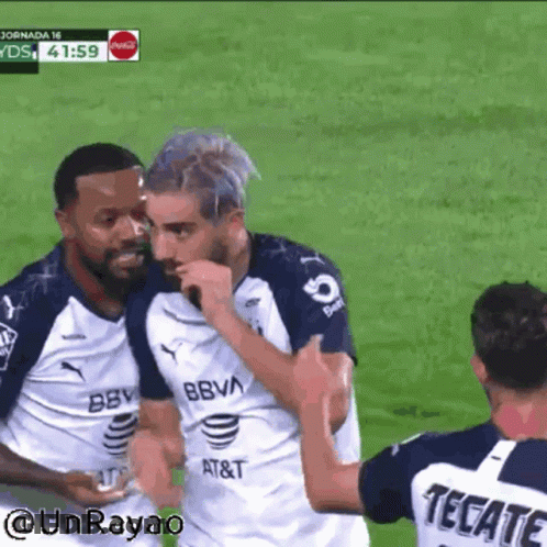 Soccer Player In Tecate Jersey Hugging Another Player GIF
