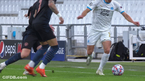 Soccer Player In Uber Eats Jersey Kicking Ball GIF