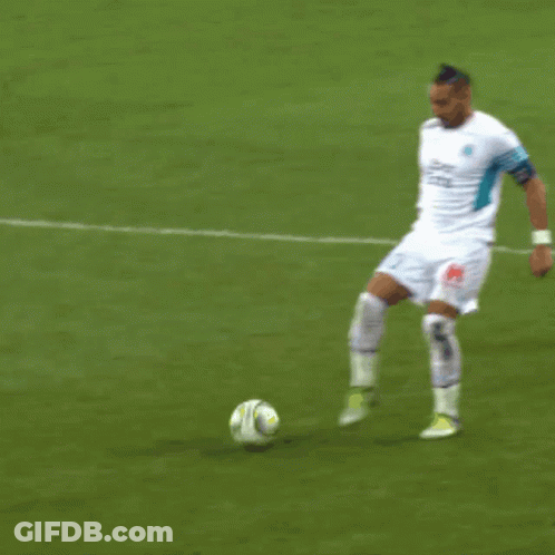 Soccer Player In Uber Eats Jersey Kicking Ball GIF