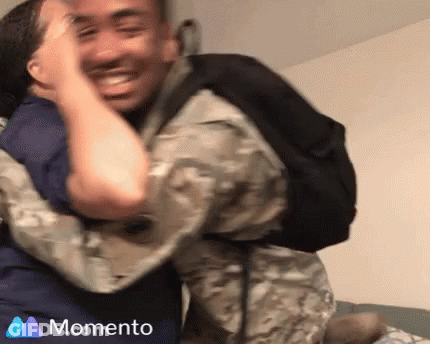 Soccer Player In White And Blue High Fives Another GIF