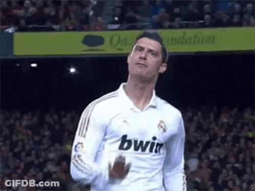 Soccer Player In White Jersey With Bwin In Front Of Crowd GIF