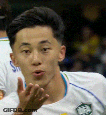 Soccer Player In White Jersey With Green Shield GIF