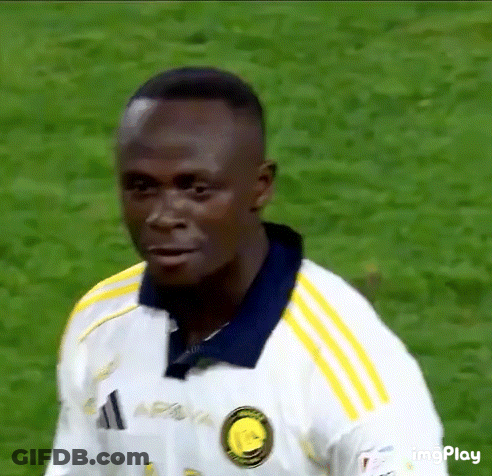 Soccer Player In White Shirt With Yellow Stripes GIF
