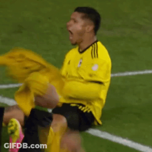 Soccer Player In Yellow Adidas Jersey Screaming GIF