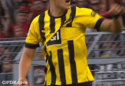 Soccer Player In Yellow And Black Striped Shirt Number 11 GIF