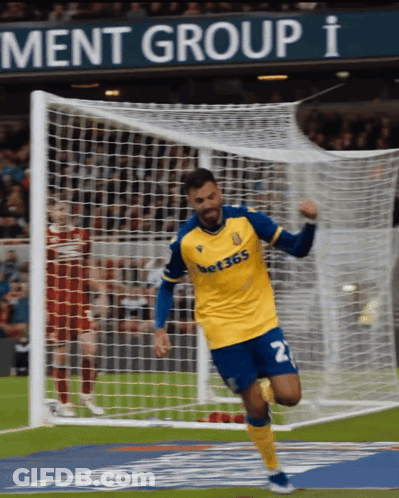 Soccer Player In Yellow And Blue Jersey Number 2 GIF