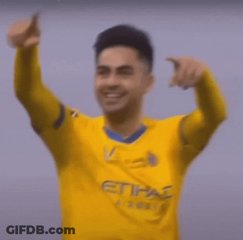 Soccer Player In Yellow And Blue Jersey Smiling GIF