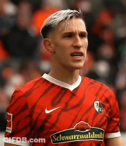 Soccer Player In Yellow Evonik Jersey GIF