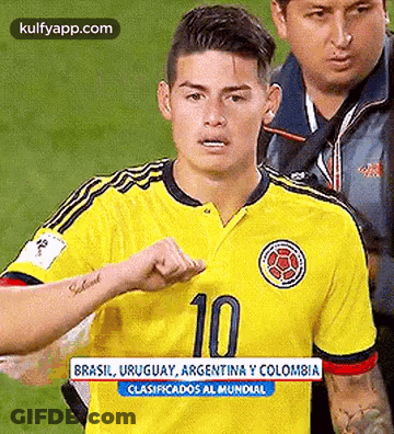 Soccer Player In Yellow Jersey Number 10 Walking On Field GIF